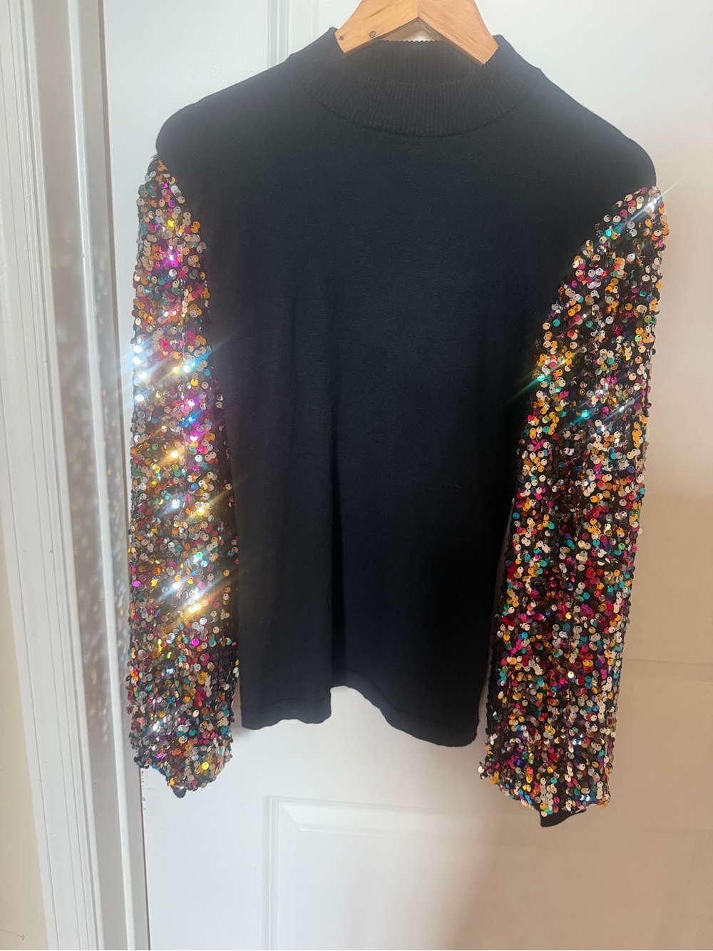 Flying Tomato Black Sweater with Multicolor Sequin Sleeves.